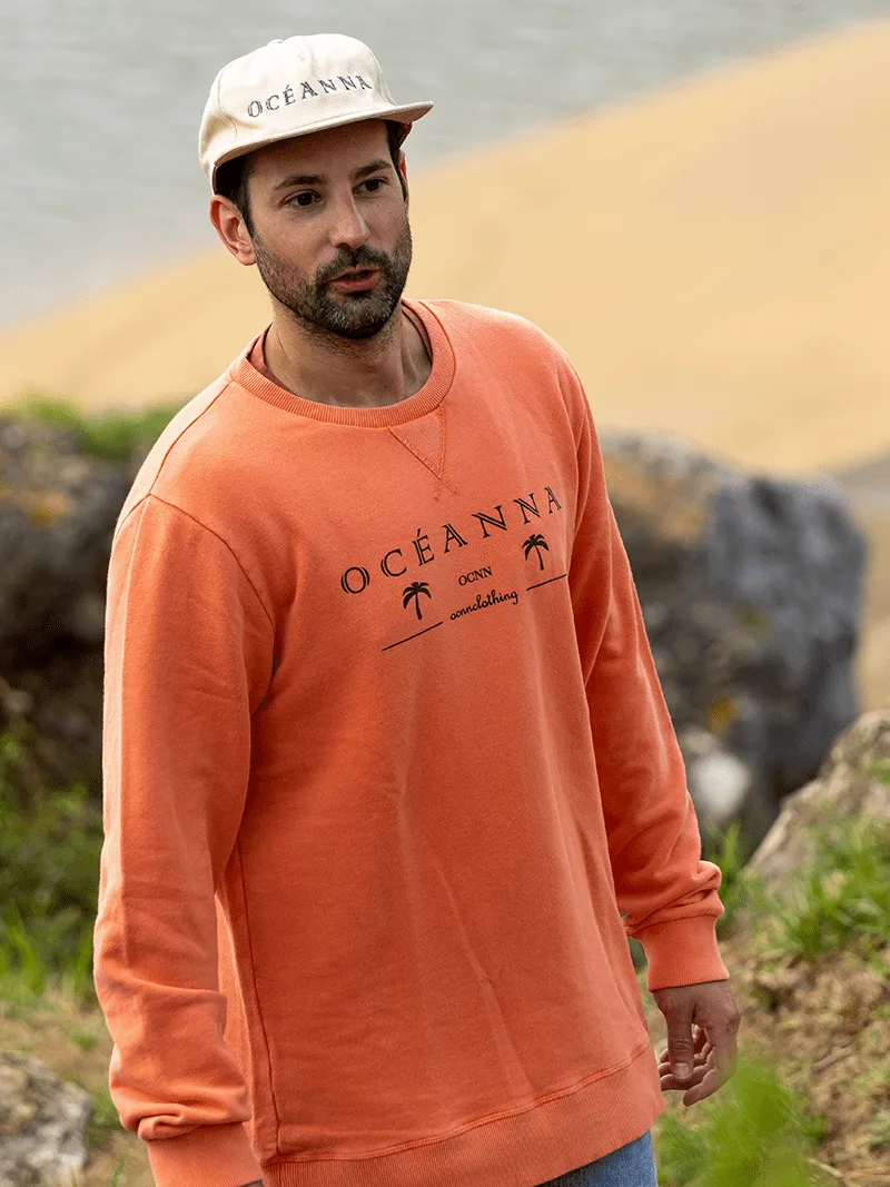 Sudadera sostenible, algodón orgánico, logo Oceanna, palmeras orange, ética